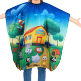 Colorful cartoon-themed kid cape with animals and a house on a white background