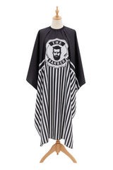 Black and white striped barber cape with 'The Barber' logo on a mannequin.