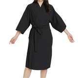 Black robe worn by a person on a white background