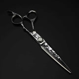 A professional Damascus pattern hairdressing scissors with a black and silver color scheme, featuring intricate engravings on the handle.