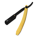 A straight razor with a gold handle and a black-colored head.