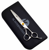 A pair of professional 440c yellow crystal hairdressing scissors placed on a black case with the logo 'K5 INTERNATIONAL' embossed on it.