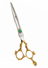 A pair of professional hairdressing scissors with a polished silver finish, featuring convex edge blades and a fixed finger rest.