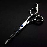 A professional hairdressing scissors with a polished finish, convex edge blades, and a fixed finger rest. The scissors are silver in color and appear to be designed for right-handed use.
