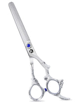 A pair of professional thinning scissors with beveled edge blades, polished finish, and an adjustable finger rest.