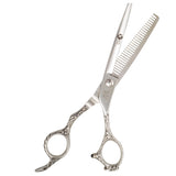 A professional silver-thrusted thinning scissors with a fixed finger rest and beveled edge blade.