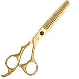 A pair of golden hair thinning scissors with a fixed finger rest and beveled edge blades.