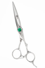 A pair of silver-colored hairdressing scissors with a green crystal on the handle, designed for professional use.