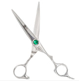 A pair of silver-colored hairdressing scissors with a green crystal on the handle, designed for professional use.