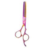 A pair of professional multicolor thinning scissors with a dragon design on the handle.