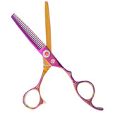 A pair of professional multicolor thinning scissors with a dragon design on the handle.