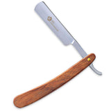 A professional single blade straight razor with a wooden handle and a plastic guard.