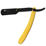 A straight razor with a gold handle and a black-colored head.